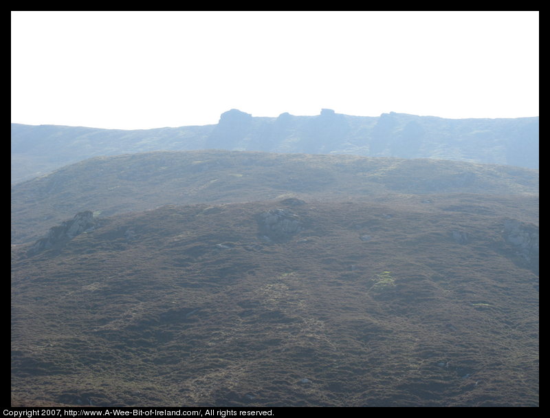 Mountain covered with grass and brown blanket bog