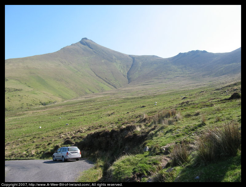 Mountain covered with grass and brown blanket bog