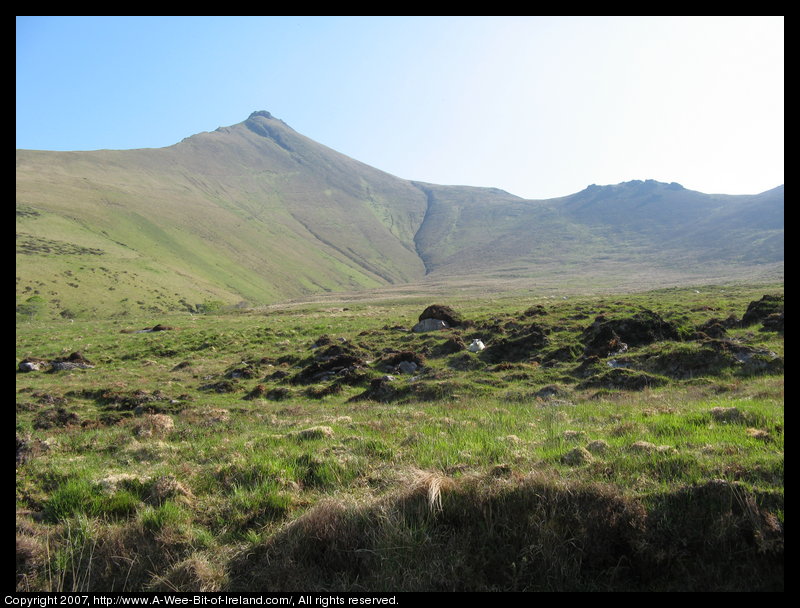 Mountain covered with grass and brown blanket bog