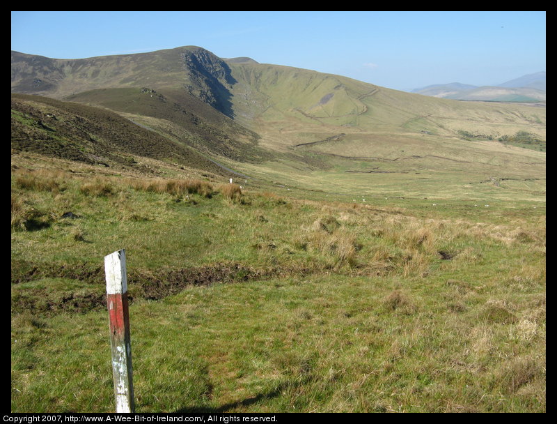 Mountain covered with grass and brown blanket bog