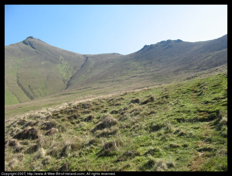 Mountain covered with grass and brown blanket bog