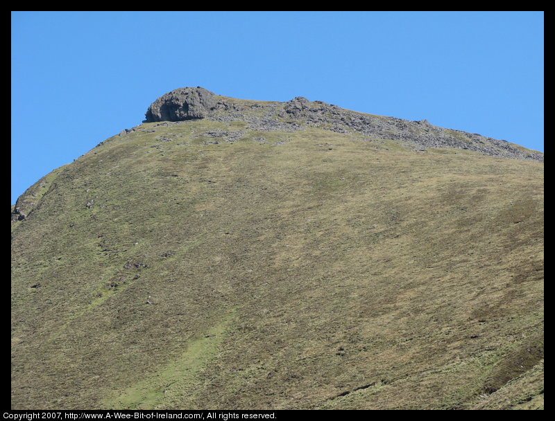 Mountain covered with grass and brown blanket bog