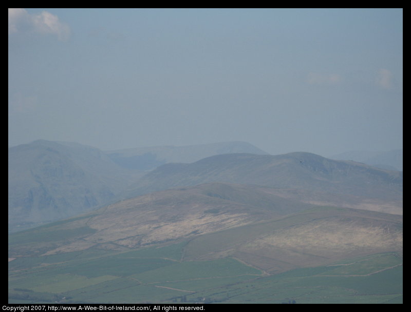 Mountain covered with grass and brown blanket bog