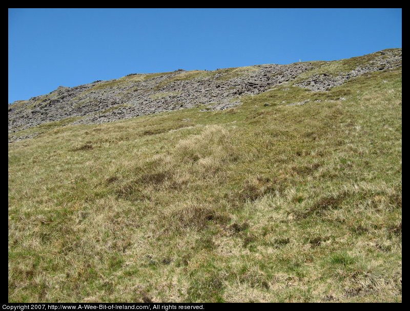 Mountain covered with grass and brown blanket bog