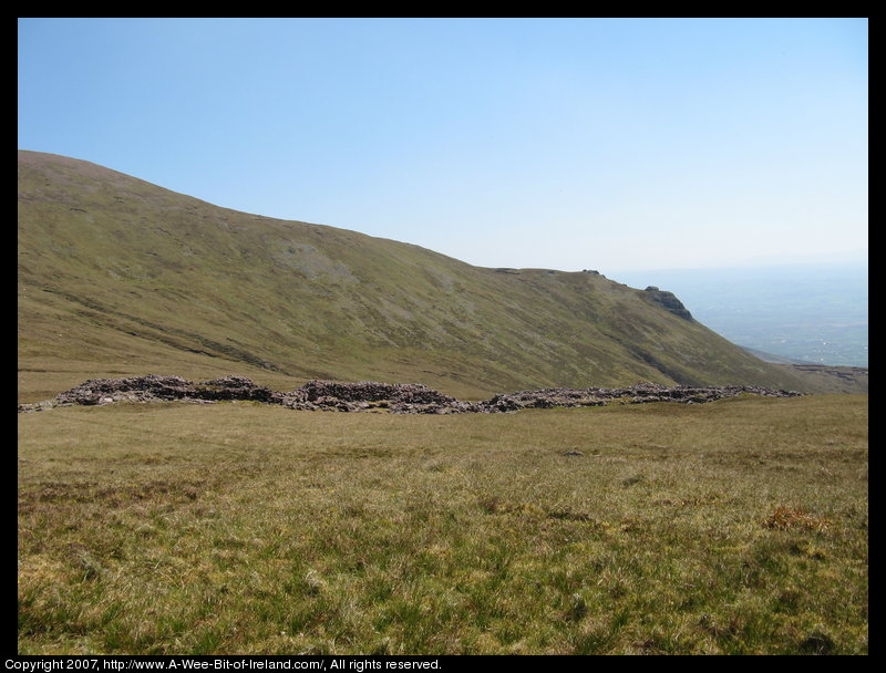 Mountain covered with grass and brown blanket bog