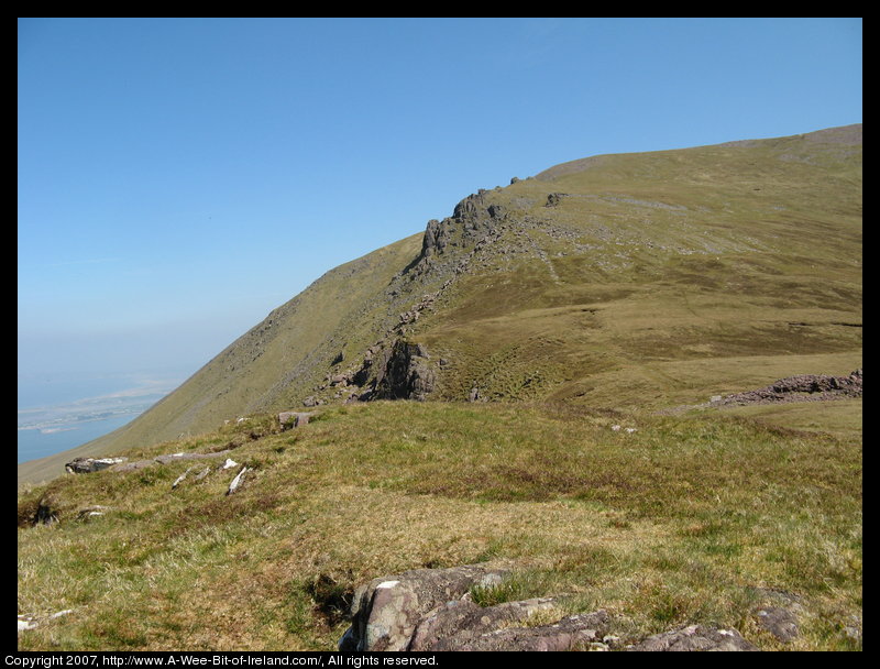 Mountain covered with grass and brown blanket bog