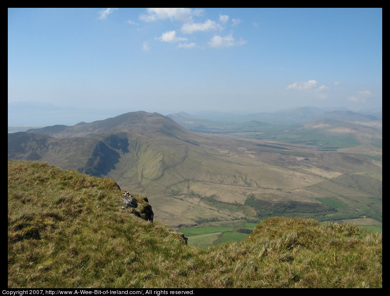 Mountain covered with grass and brown blanket bog