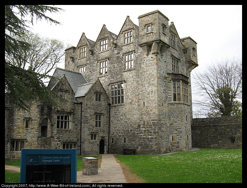 A Castle built of stones and mortar with windows and an attached manor house that were added in the 18th century.