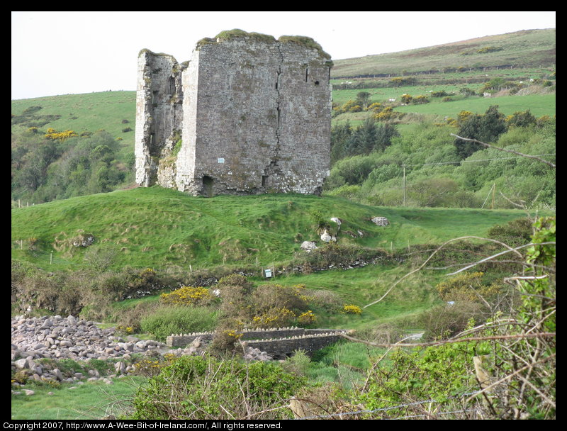 A ruined castle next to the ocean