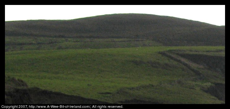 ring fort on hill above beach