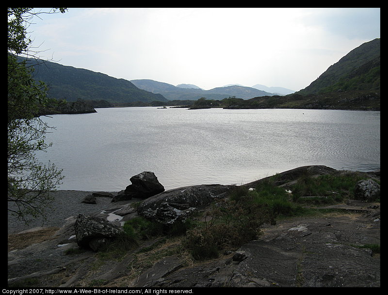 A lake is surrounded by mountains