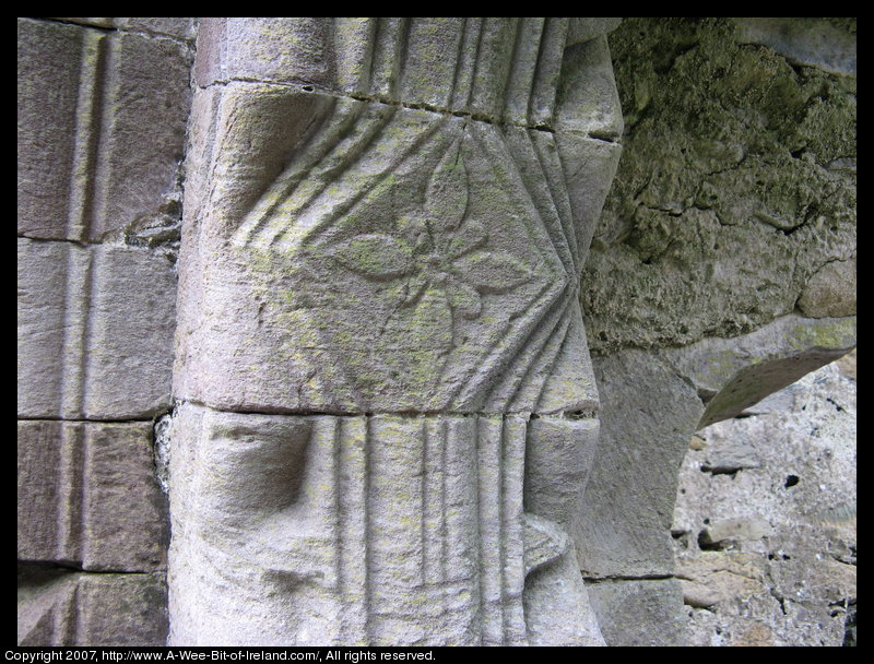 Decoration is carved into the stone of the church wall.