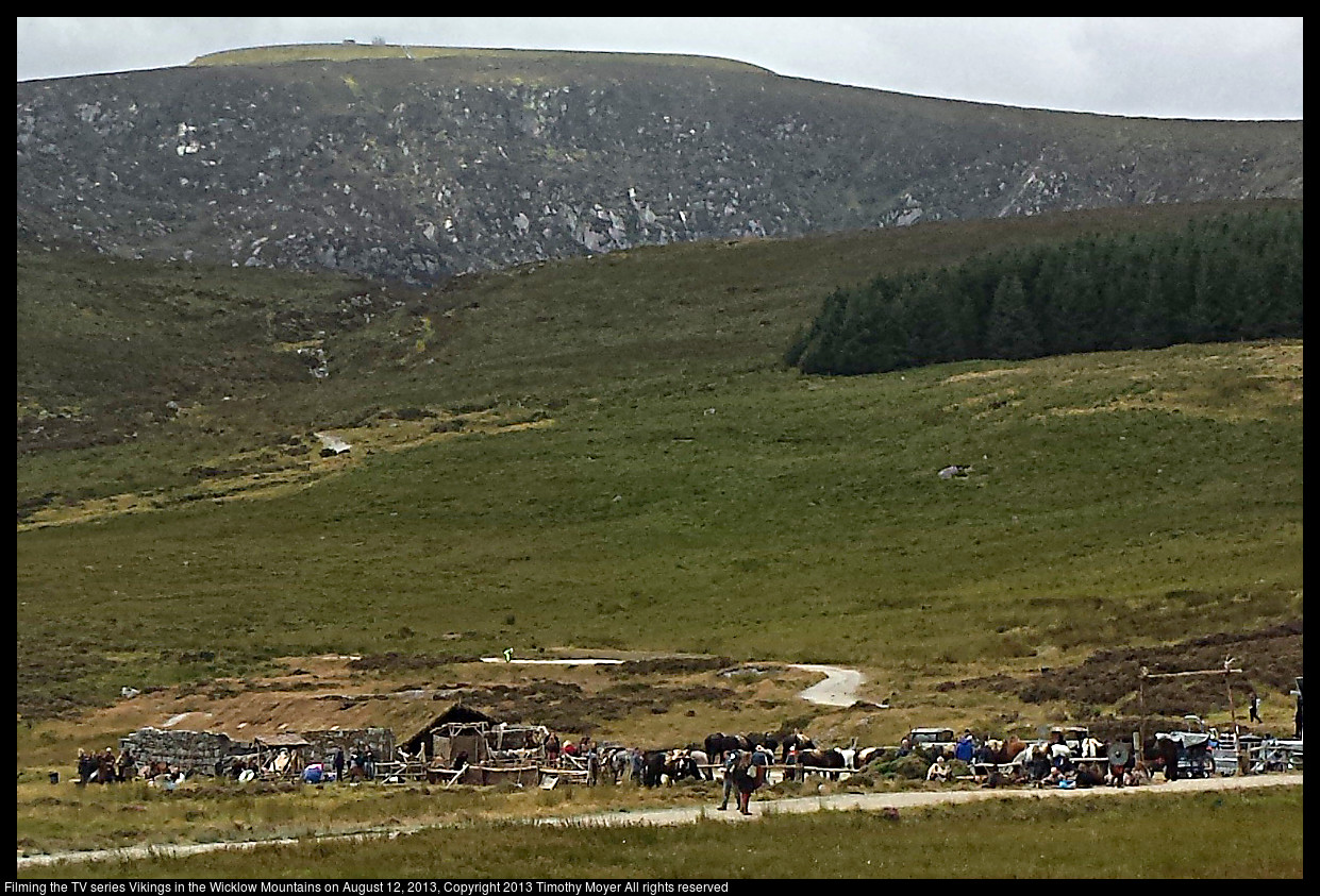 Horses and trucks and actors in the mountains.