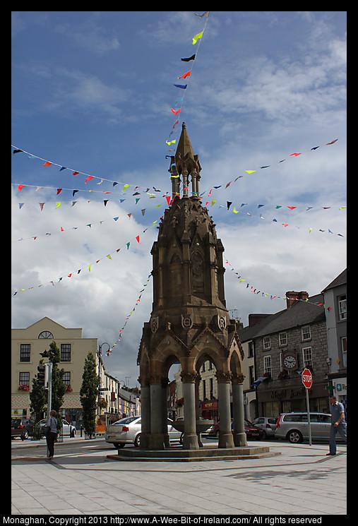 A town square with colorful buildings and a tower in the center.