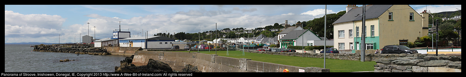 Panorama of Greencastle, Inishowen, Donegal, Ireland showing the coast guard station and ships for sale.