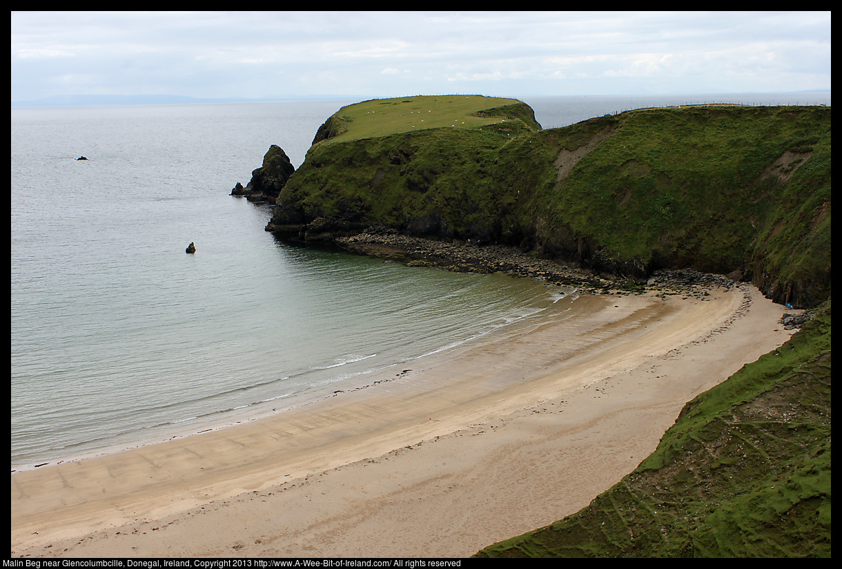 A beach surrounded by cliffs.