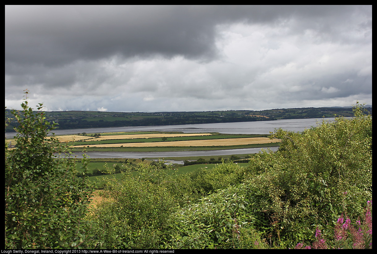 An inlet from the Atlantic Ocean with fields near the water and houses on the far shore.