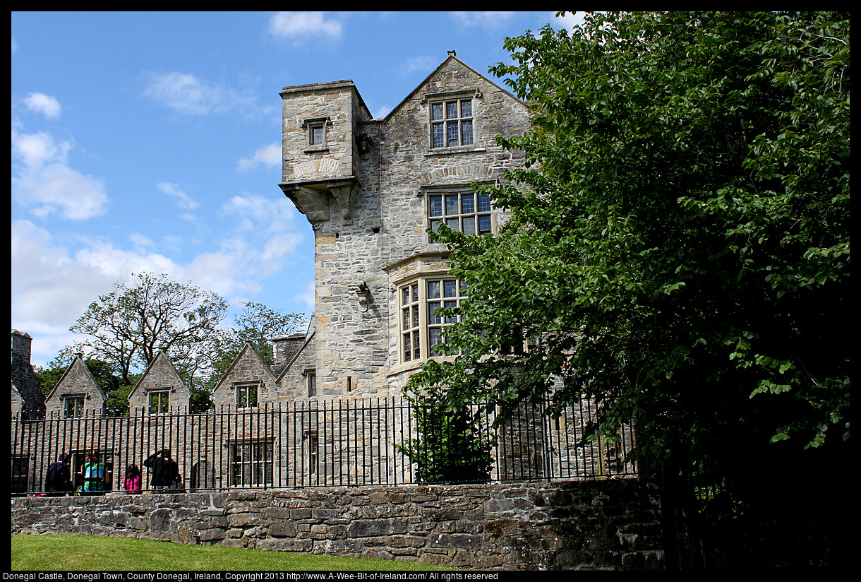 A Castle with an attached residence. The residence was destroyed by fire, but the stone walls are still standing.