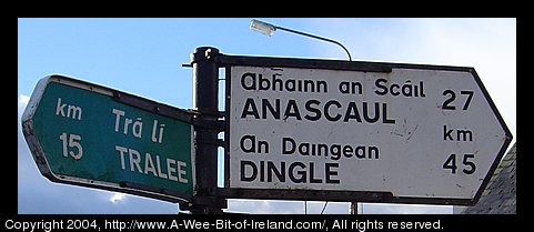An Irish road sign pointing to Anascaul, Dingle, and Tralee