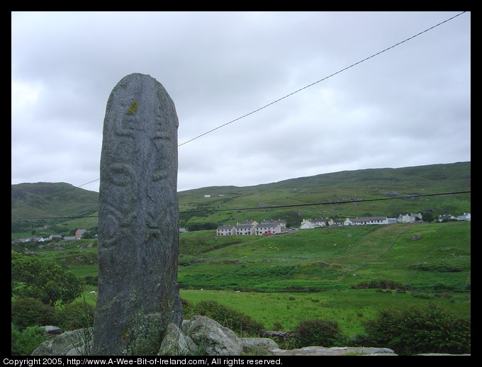 Slab of stone with a designs incised, possibly a lizard and celtic knots.