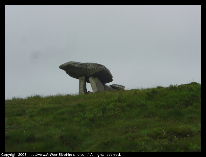 Kilclooney More Dolmen in County Donegal. A rock the size of a small
 automobile has been placed on top of standing stones about 6000 years ago.