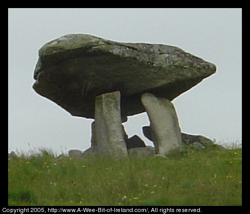 Kilclooney More Dolmen in County Donegal. A rock the size of a small
 automobile has been placed on top of standing stones about 6000 years ago.
