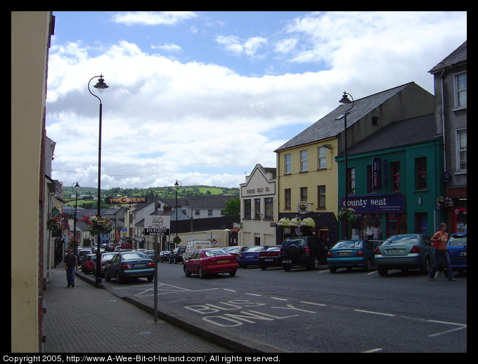 View down a curving street in Letterkenny, Donegal with a green hill
in the distance