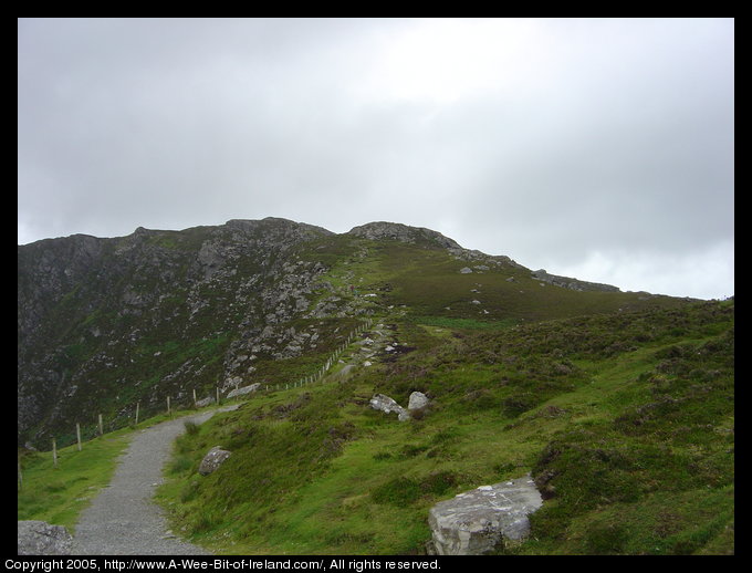 Path near Slieve League sea cliffs with a fence on the left.