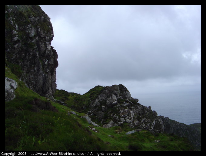 Near the Slieve League sea cliffs, large rocks on the left toward the
 edge of the cliff.