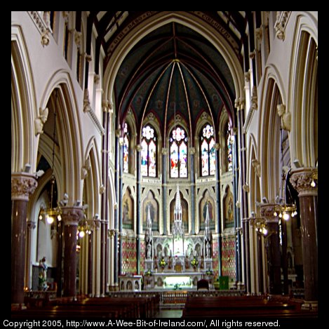 The altar and stained glass windows in the interior of St. Peter's Cathedral in Drogheda, Ireland.